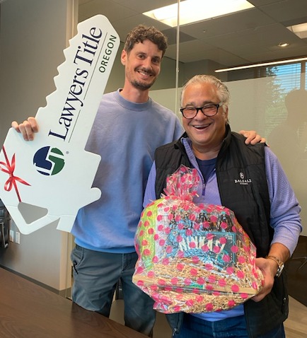 Michael Kiriazis with a buyer client on closing day.