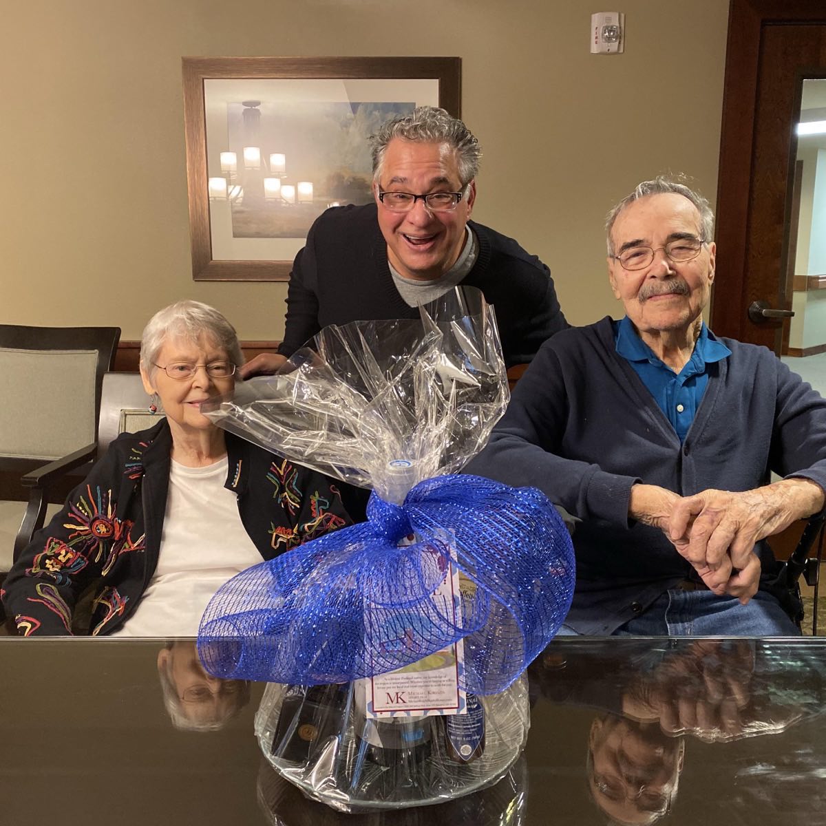 Michael Kiriazis with repeat clients and a closing gift basket.