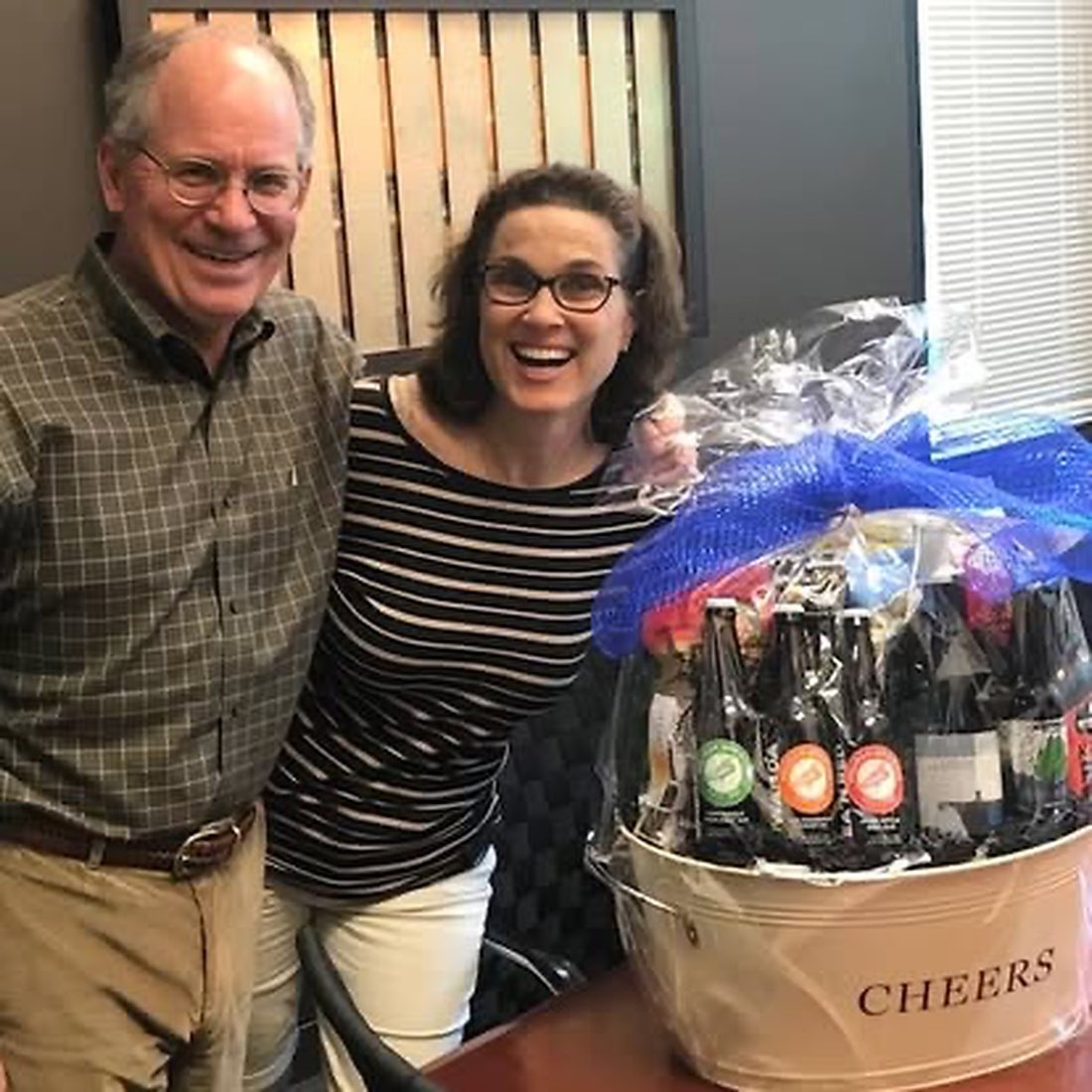 Happy clients celebrating a successful closing.