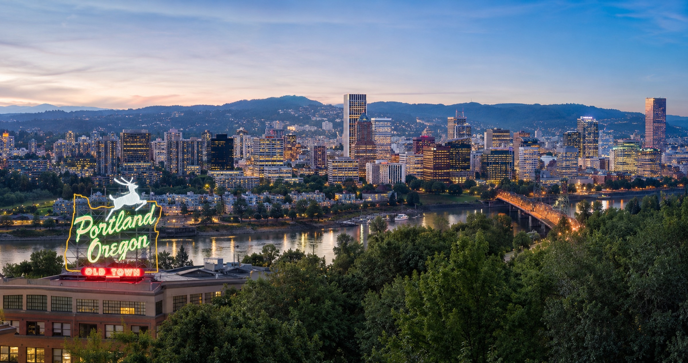Portland skyline with the West Hills behind it — the city seen across the river.
